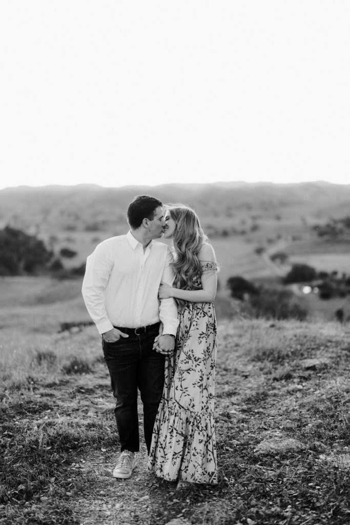 Black and white engagement kiss photo