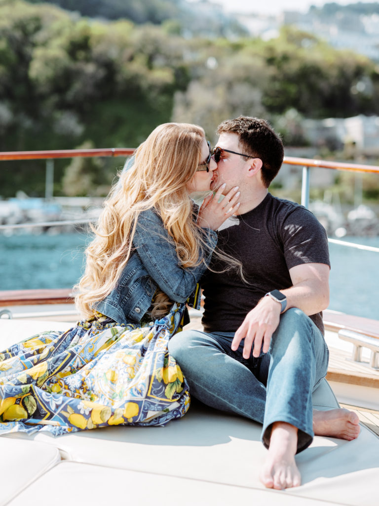 Couple kissing on a boat in the Mediterranean 