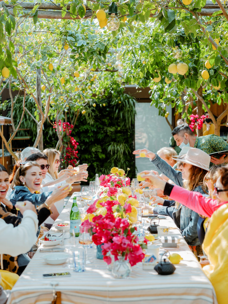 People toasting at a Capri Luncheon at Da Paulino Restaurant.