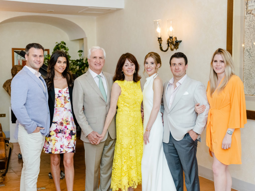 Extended family portrait at couple's Wedding Rehearsal Dinner Belmond Caruso