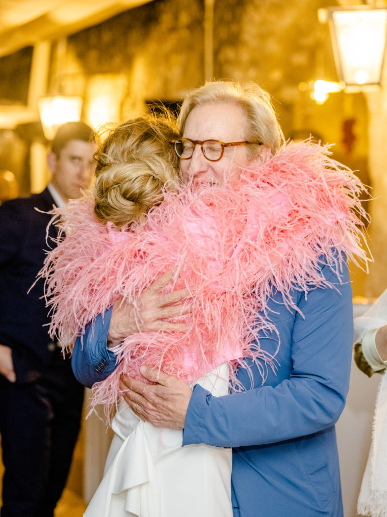 Father hugging daughter at her Belmond Caruso rehearsal dinner