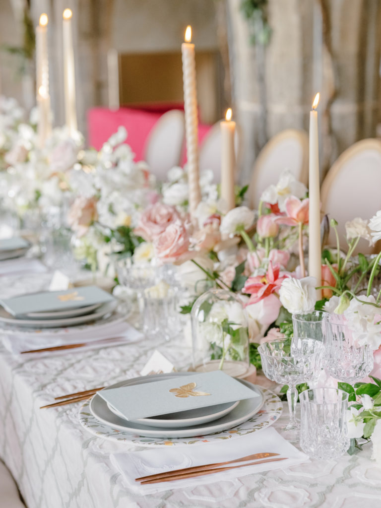 Villa Cimbrone wedding reception table adorned with flowers and tall candlesticks