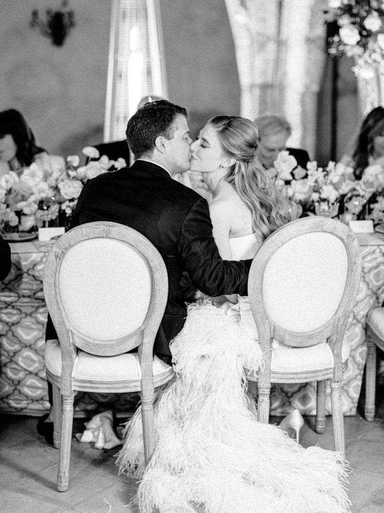 Bride and groom kissing at their Villa Cimbrone wedding reception 